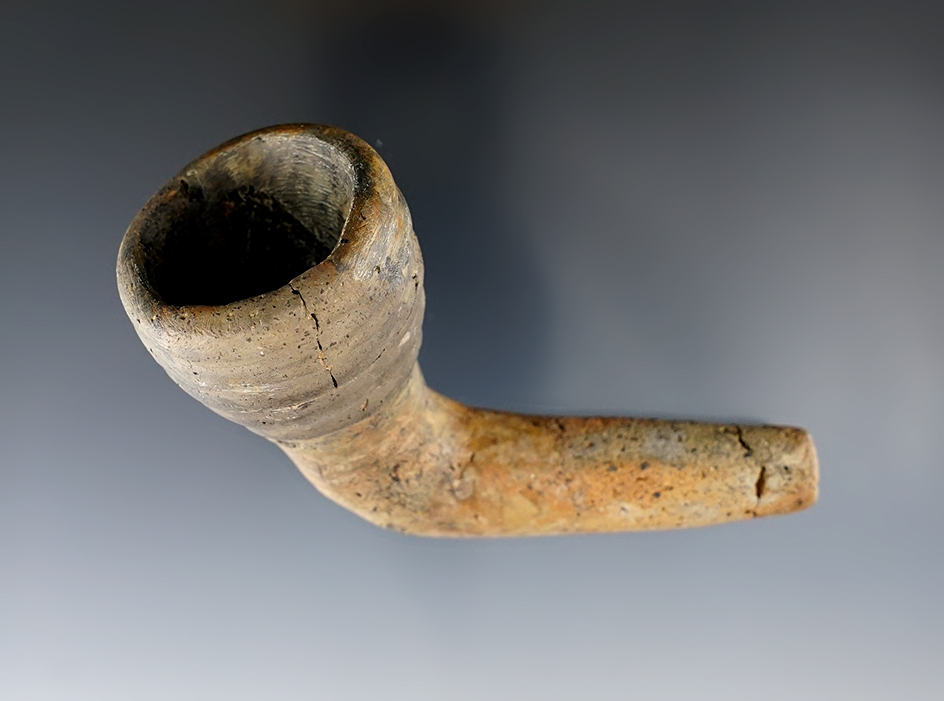 3 1/8" Iroquois clay ring bowl pipe with restoration to the bowl and elbow. Found in New York.
