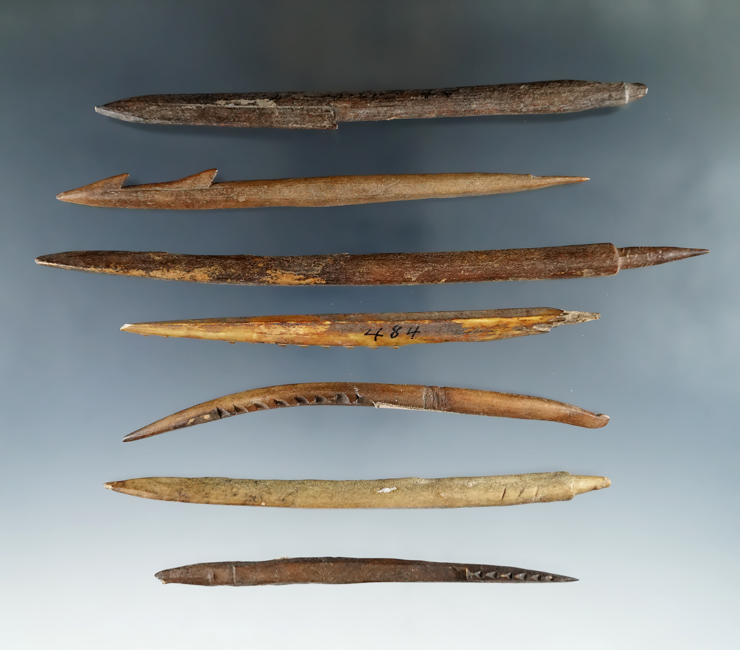 Set of seven bone harpoon tips found in Alaska, largest is 6 1/4".