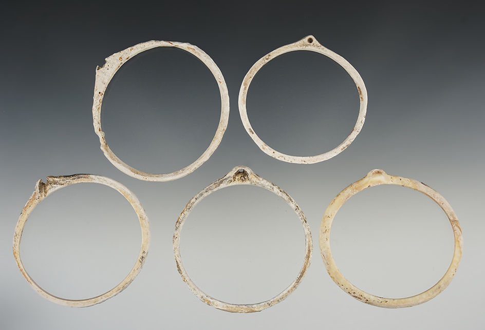 Set of five very old nicely cut shell ornaments recovered in New Mexico. Largest is 2 3/4" wide.