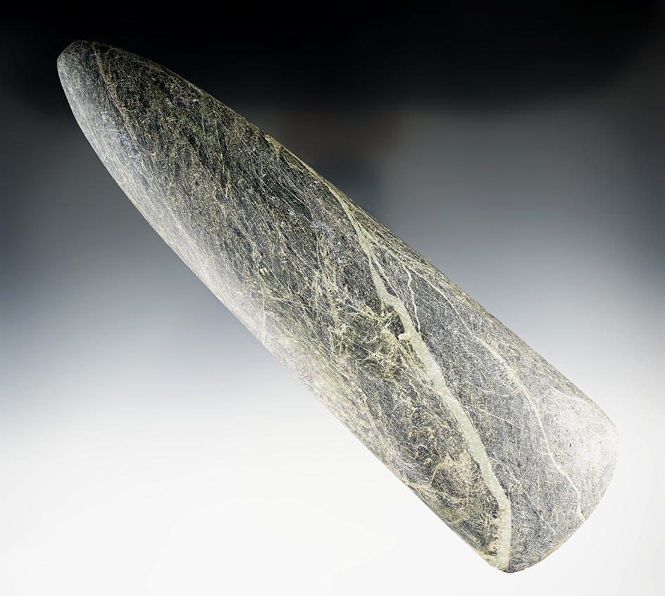 Large 8 7/8" tapered Poll Celt found in New Guniea. Made from exotic material.