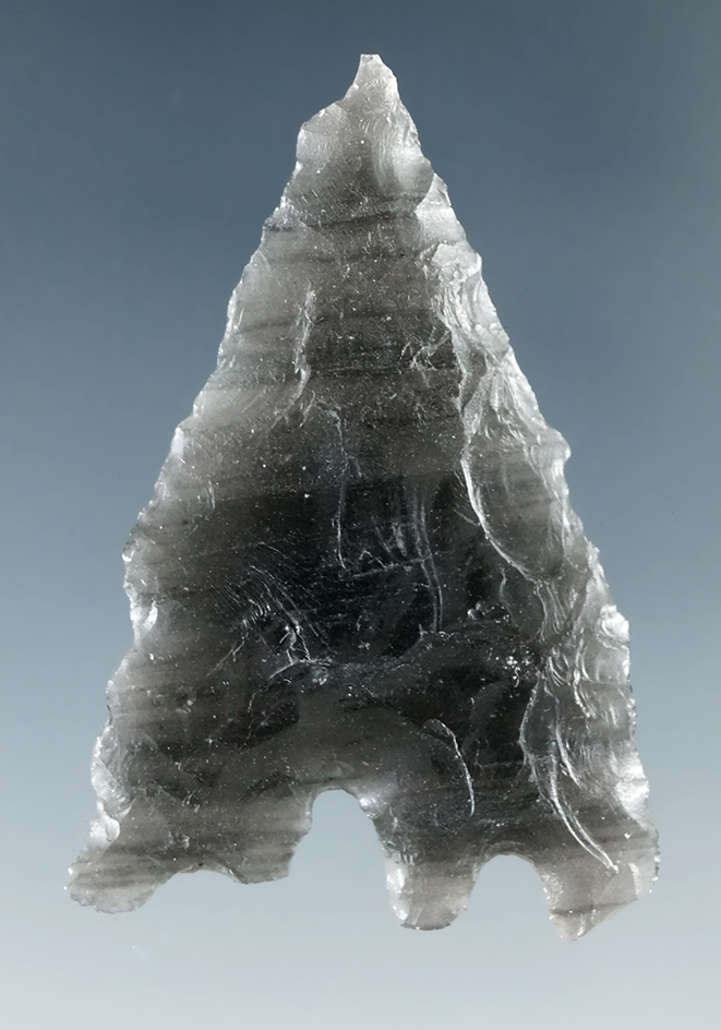 Unique anciently salvaged base on this 1 9/16" obsidian point found in Humboldt Co., Nevada.