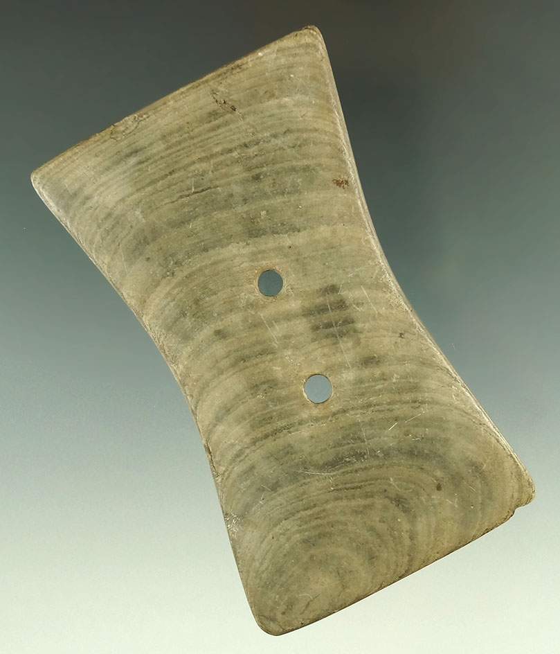 4" highly patinated Adena Bi-Concave Gorget made from banded slate. Found in Ohio.