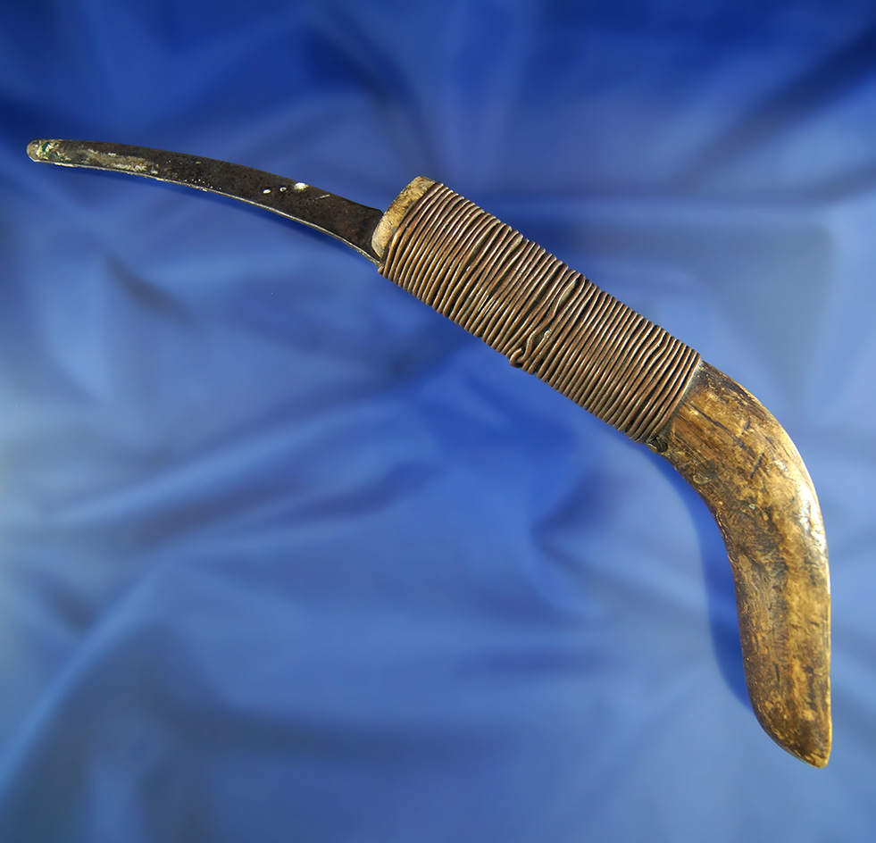 Alaskan historic era Knife made from caribou antler with a wire wrapped handle and metal Blade.