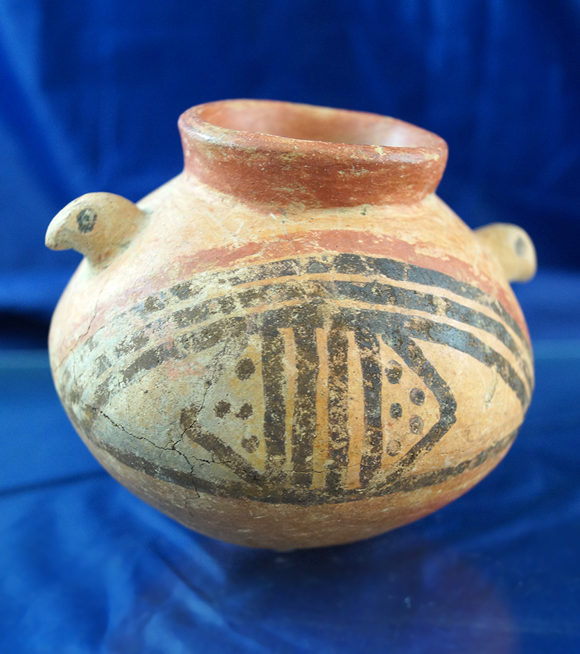 4 1/2" Diquis Jar found in Costa Rica with dual effigy handles.  Some pressure cracks to surface.