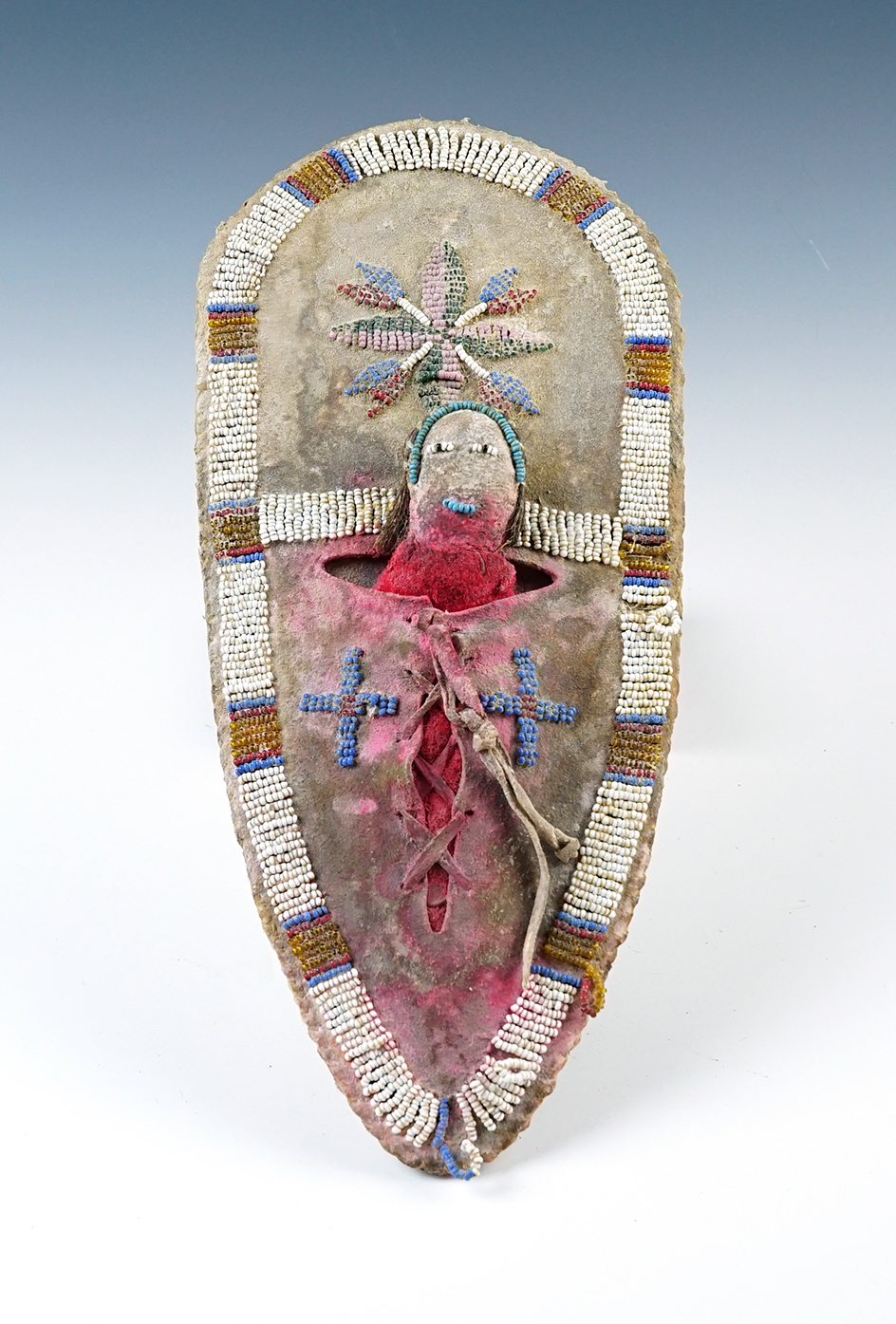 Very old beaded doll and cradle board, 11" tall. Minimal bead loss. A couple loose strands. 