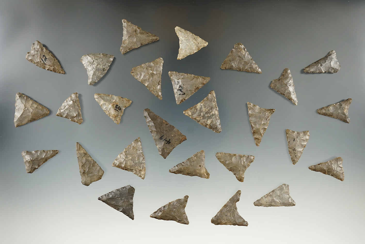 Group of 27 Mississippian triangle points found it McCleary site in New York.