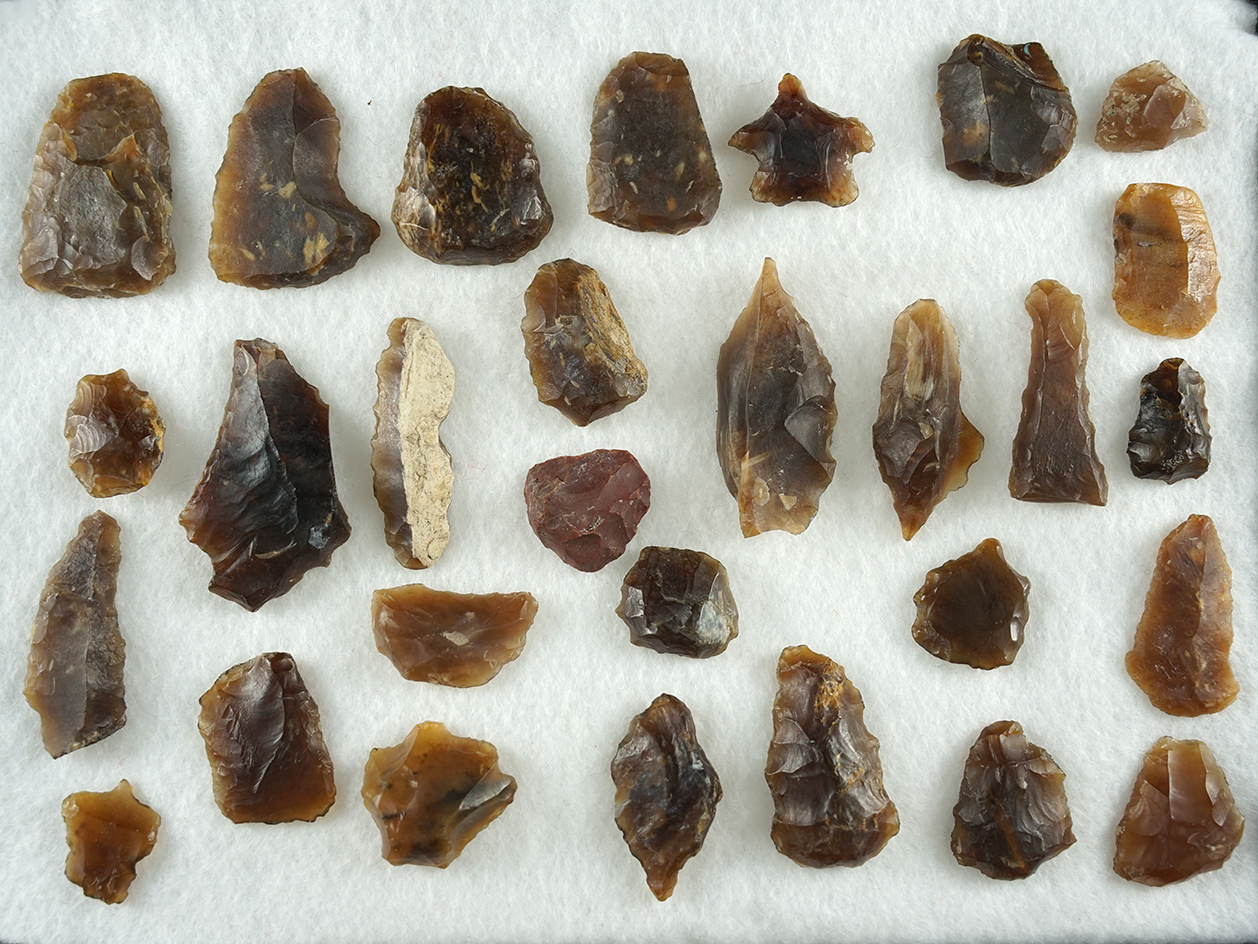 Group of mostly Knife River Flint scrapers and tools found in Eastern South Dakota.