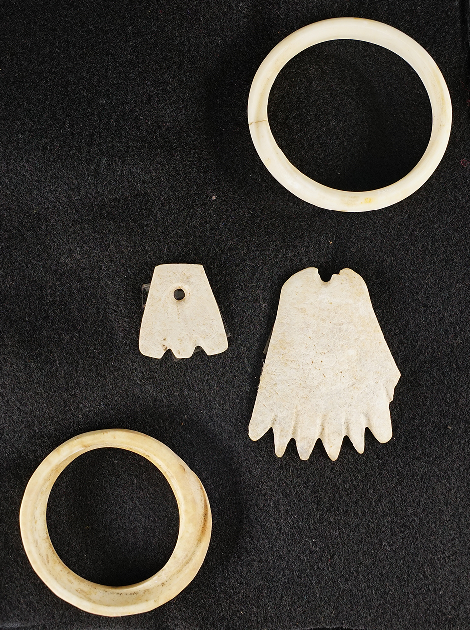 Set of four assorted shell ornaments from the Historic Period, circa 1880-1900. Largest is 2 3/4".