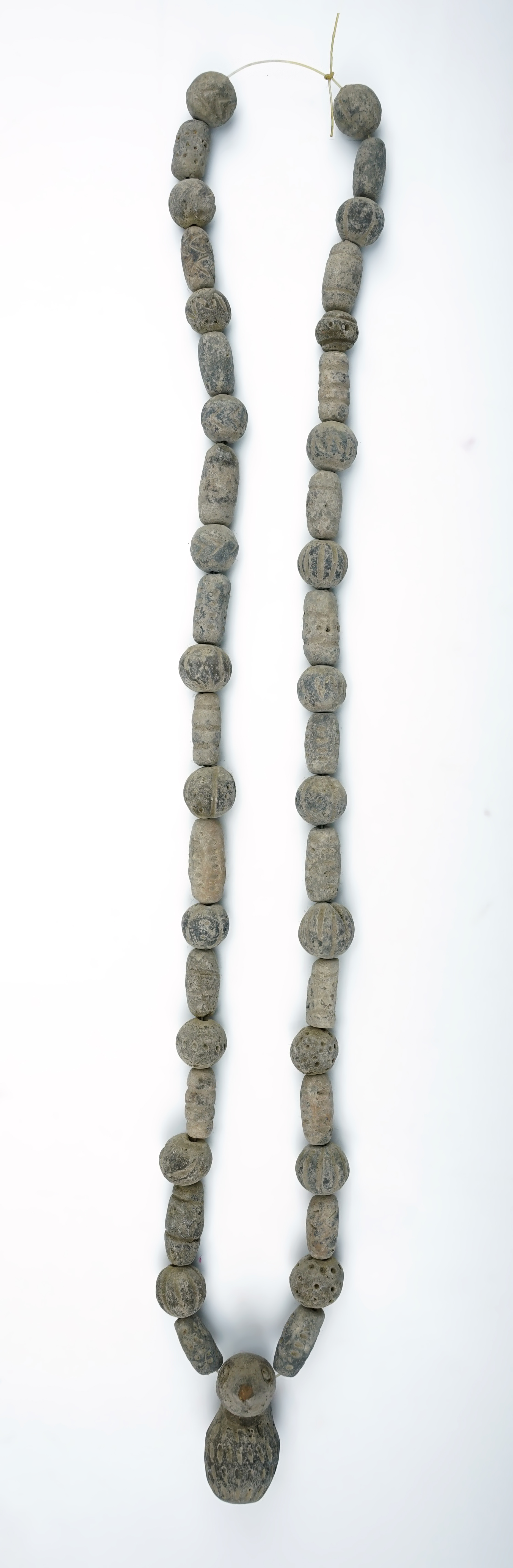 30" Strand of Pre-Columbian clay beads found in Mexico. Includes a nicely crafted bird effigy