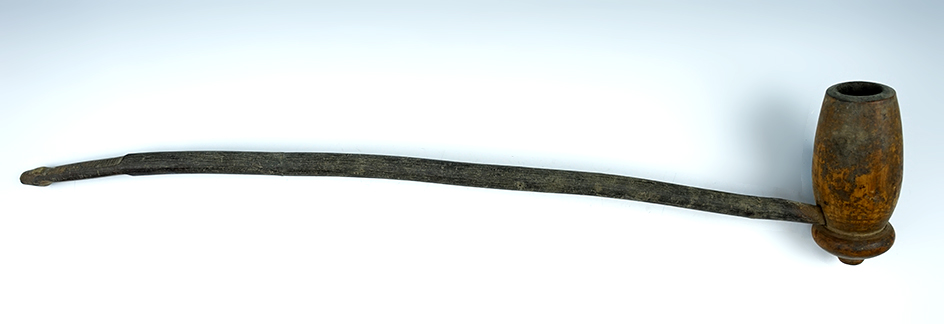 Nicely carved vintage wood pipe with original stem, circa 1800's. 17 1/2" overall length.