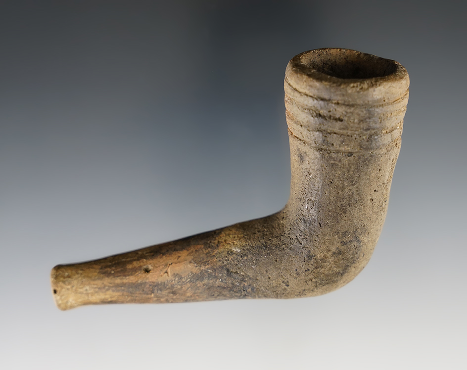 3 1/2" Iroquois Clay Ring Bowl Pipe with a broken and mended stem, found in New York.