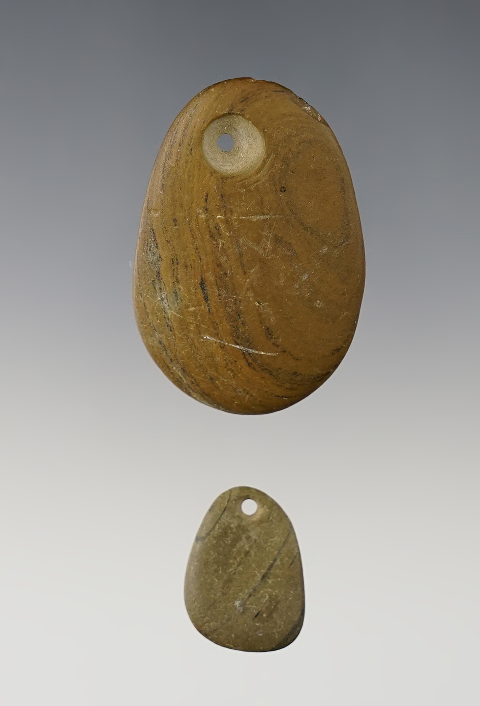Pair of Pebble Pendants - Wabash Co., Illinois. Ex. Clark Family collection. The largest is 1 13/16".