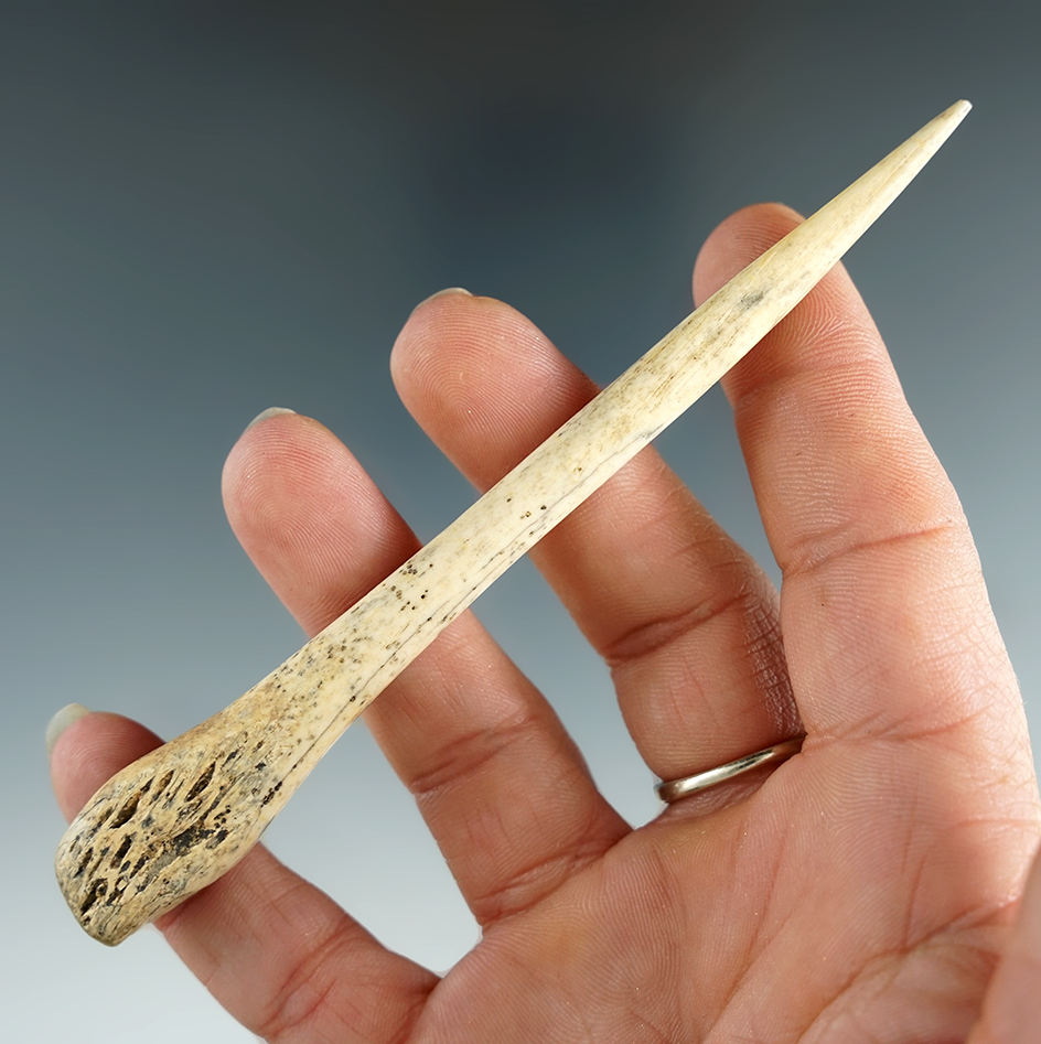 Nicely polished 4 11/16" bone awl found in eastern South Dakota.