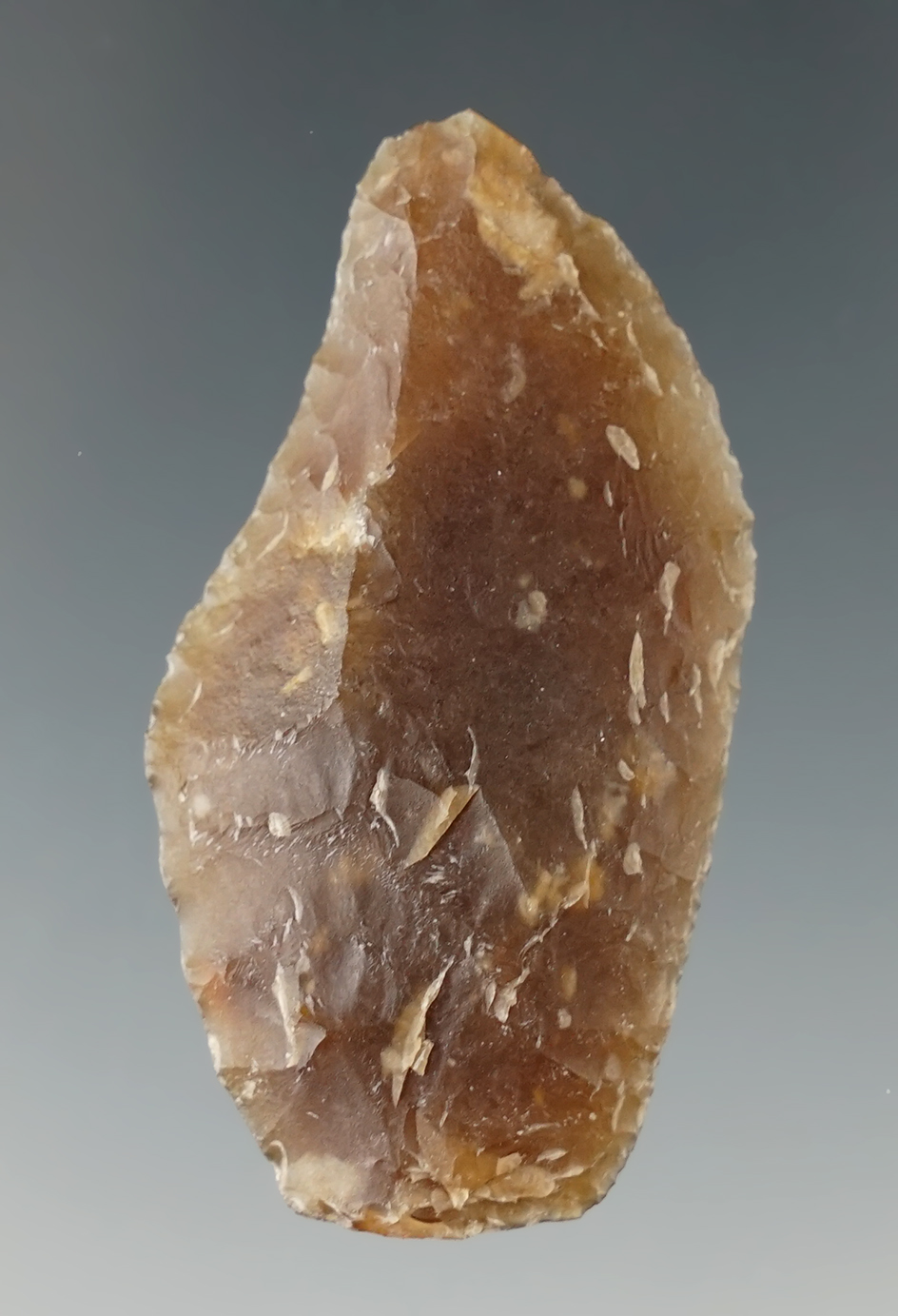 1 7/8" hafted shaft scraper made from Knife River Flint found in Eastern South Dakota.