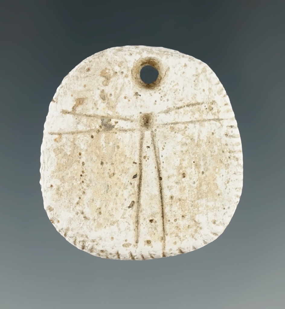 Very unique beautifully decorated 1 3/8" drilled shell pendant with engravings and tally marks. WA.