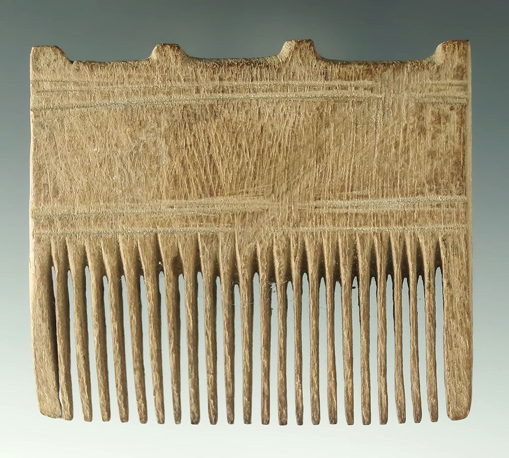 Exceptionally well carved 2 11/16" wide wooden Inca comb. Found in Peru.