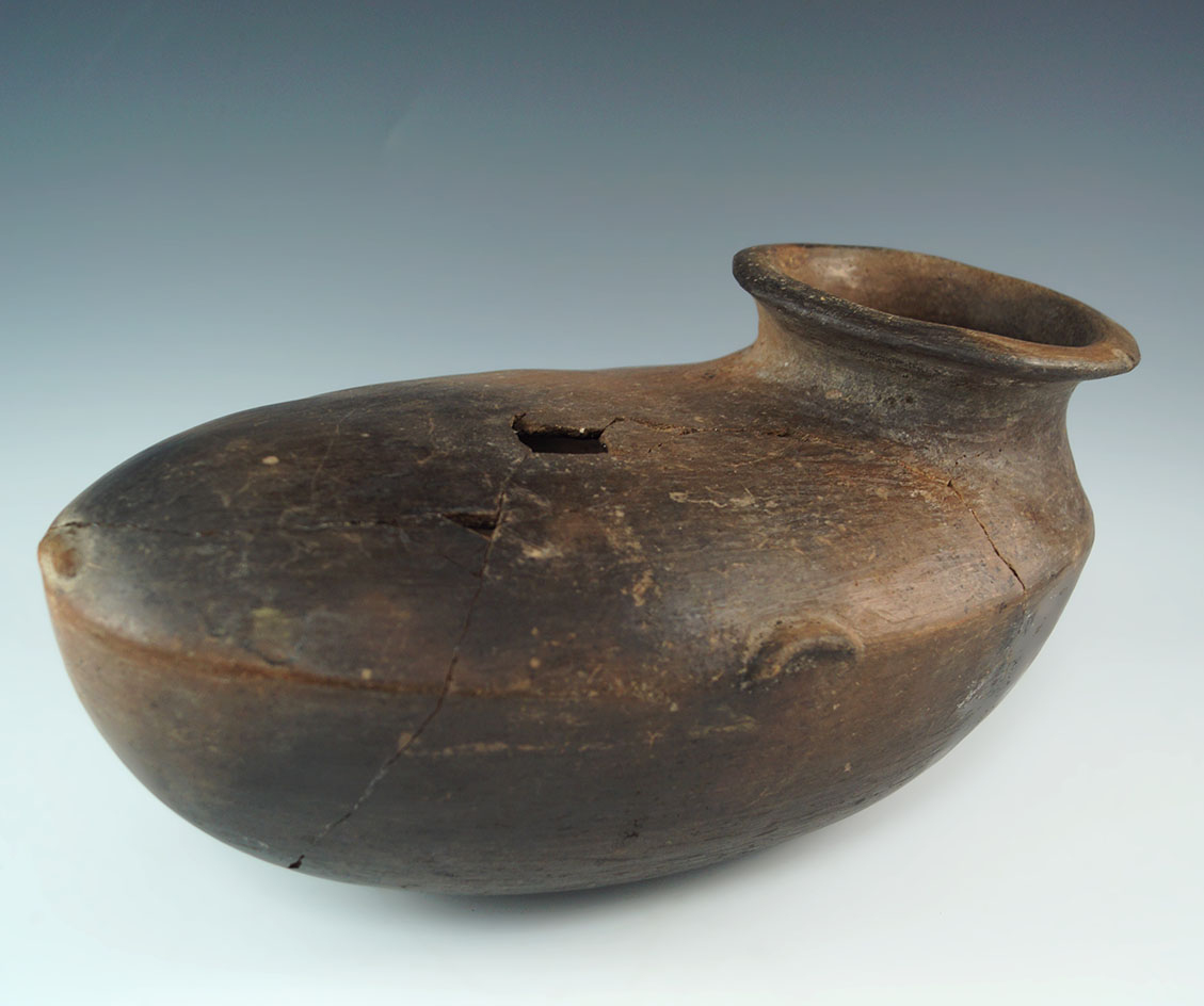 10 3/4" long by 5 1/4" tall Moccasin shaped pottery vessel found in north central Mexico.