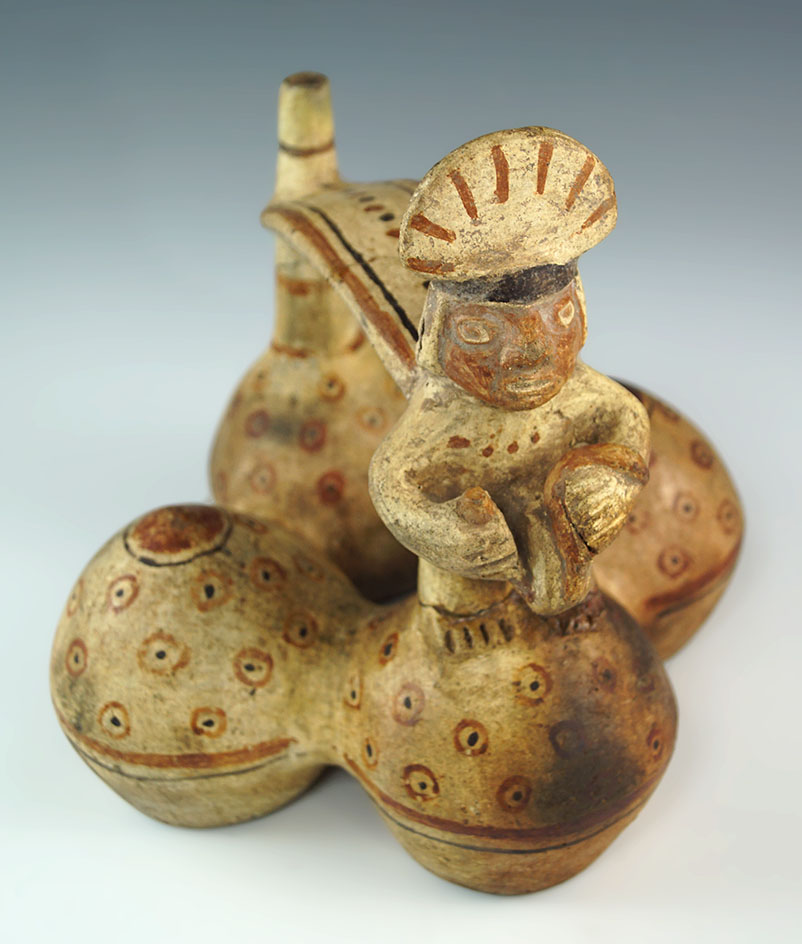 Highly detailed Moche 4-chamber stirrup handled vessel - broken and glued in two places. Peru.