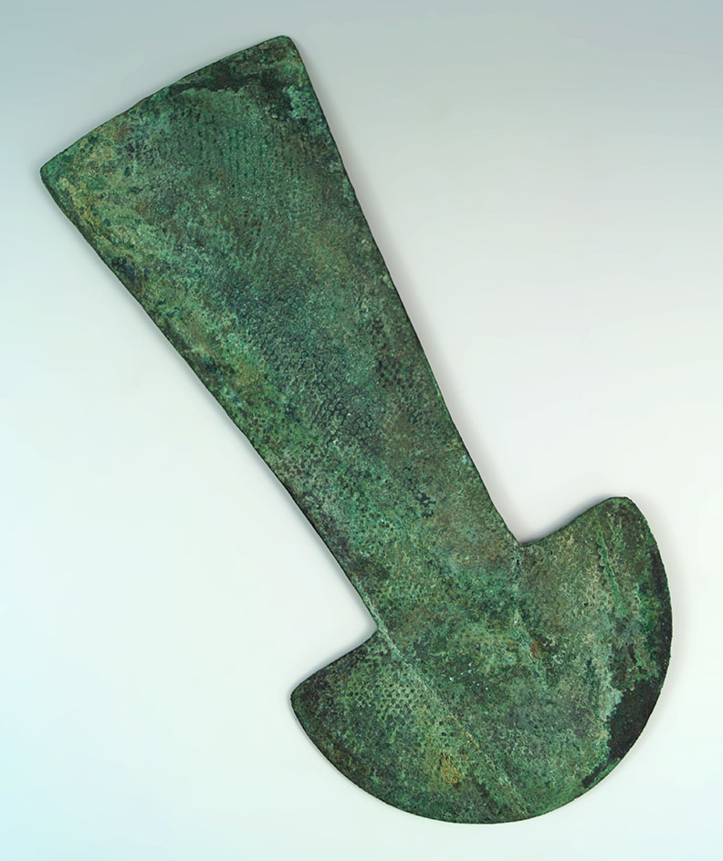 Moche copper Tumi that is 10 1/2" by 5" long found in Peru with remnants of fabric remaining.