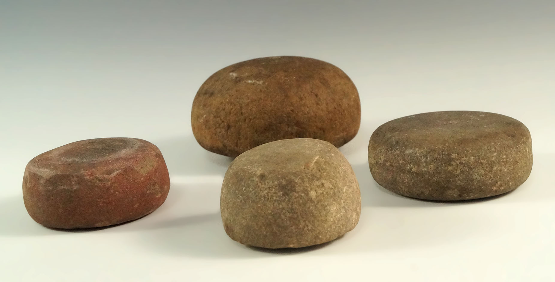 Group of four Game Stones/Discoidals, largest is 3 1/2". All were found on a shelf …