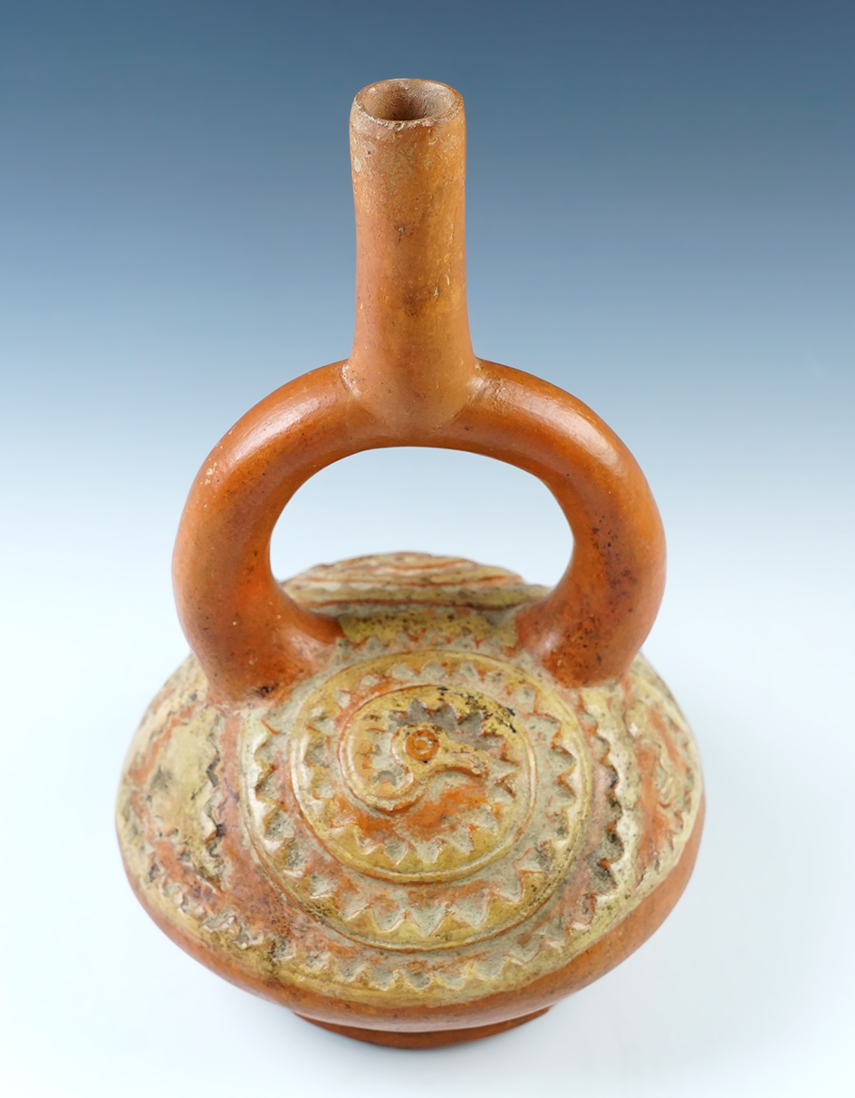 9" tall stirrup bottle with relief design and Avian effigies. Pre-Columbian Moche Culture, Peru.