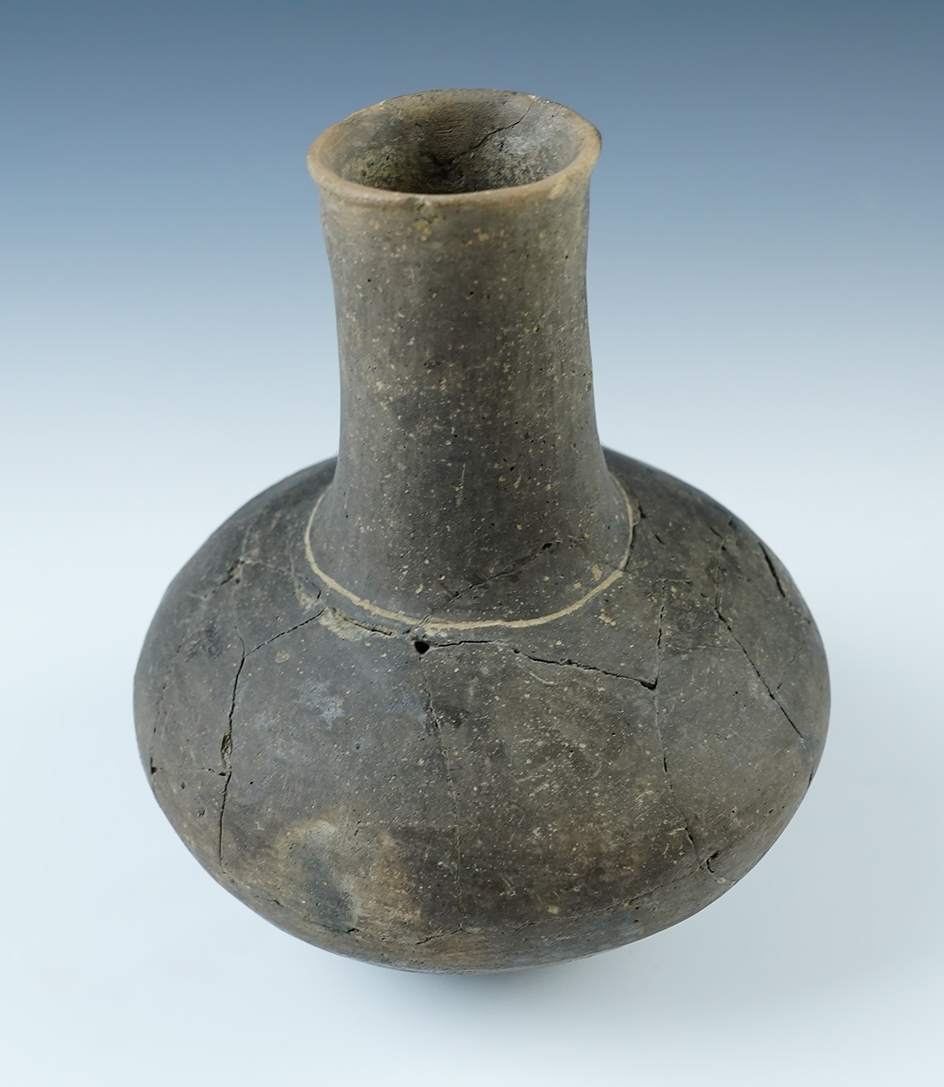 6 1/2" tall x 5" wide pottery bottle with multiple reattached pieces,Clark Co., Arkansas. COA.