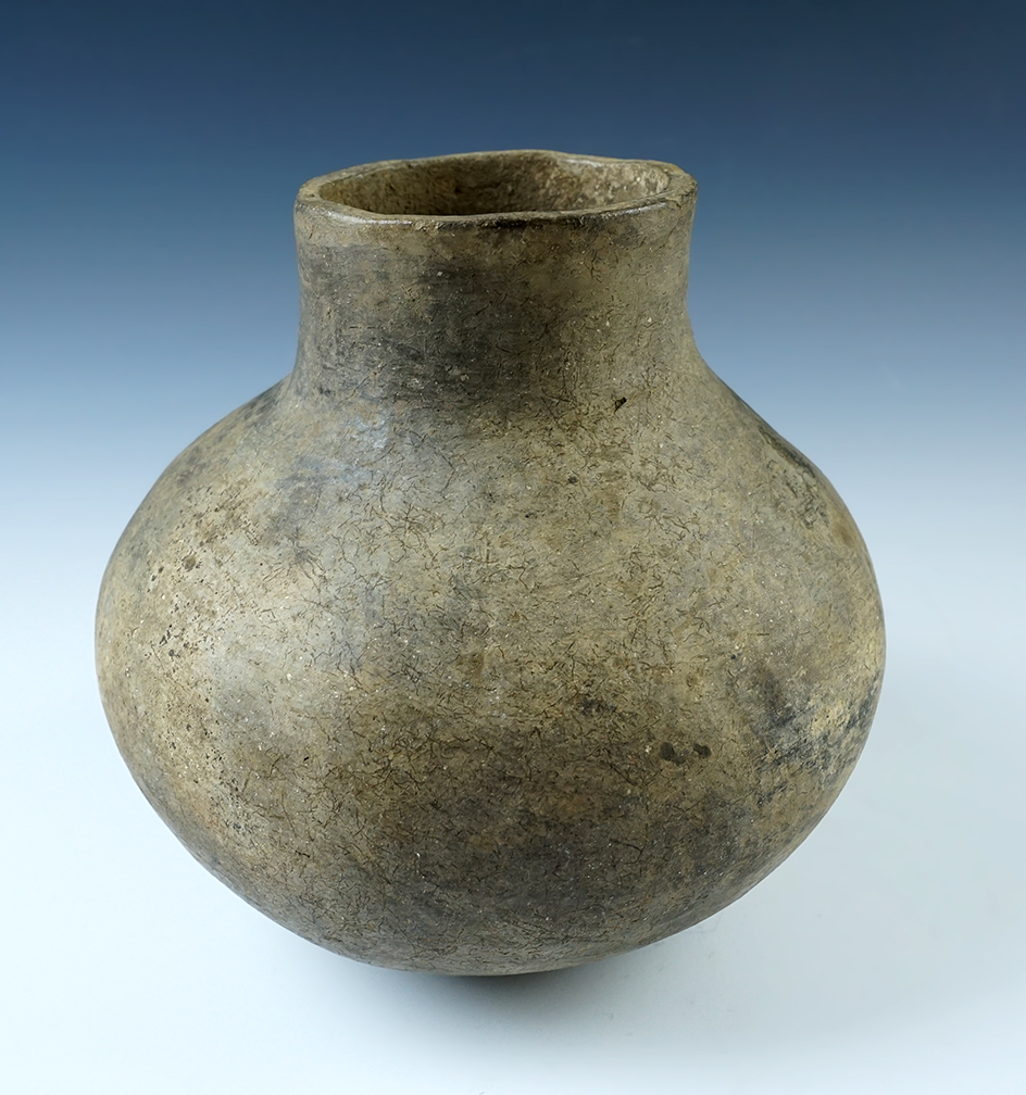 7 1/2" tall x 6 3/4" wide Short Neck Shell Tempered Clay Bottle, Arkansas. Some restoration. 