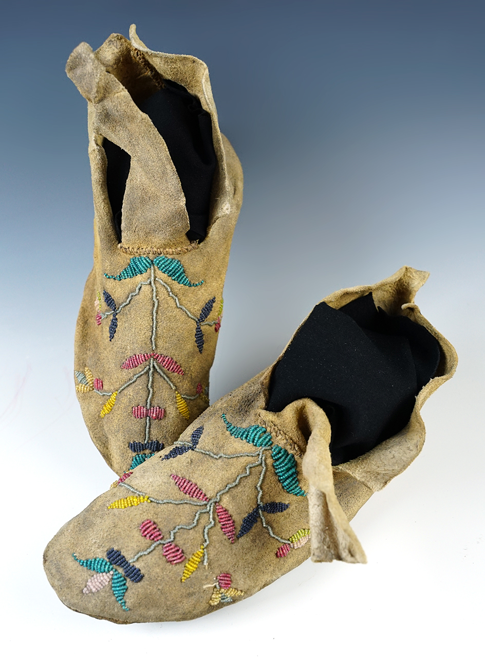 Pair of Beaded Leather Moccasins with floral design in decent condition, 8 1/2" long. 