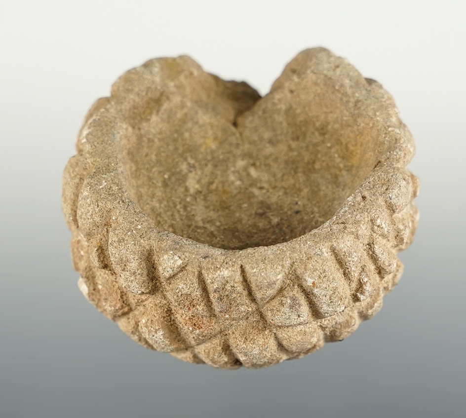 Uniquely styled Sandstone Bowl that measures 2 1/4" wide. Includes the original collector card.