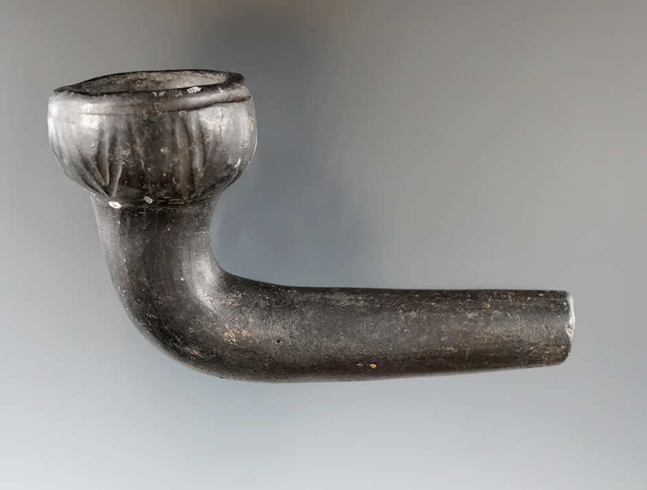 4" long Huron acorn pipe that is broken and mended at the elbow with some restoration.