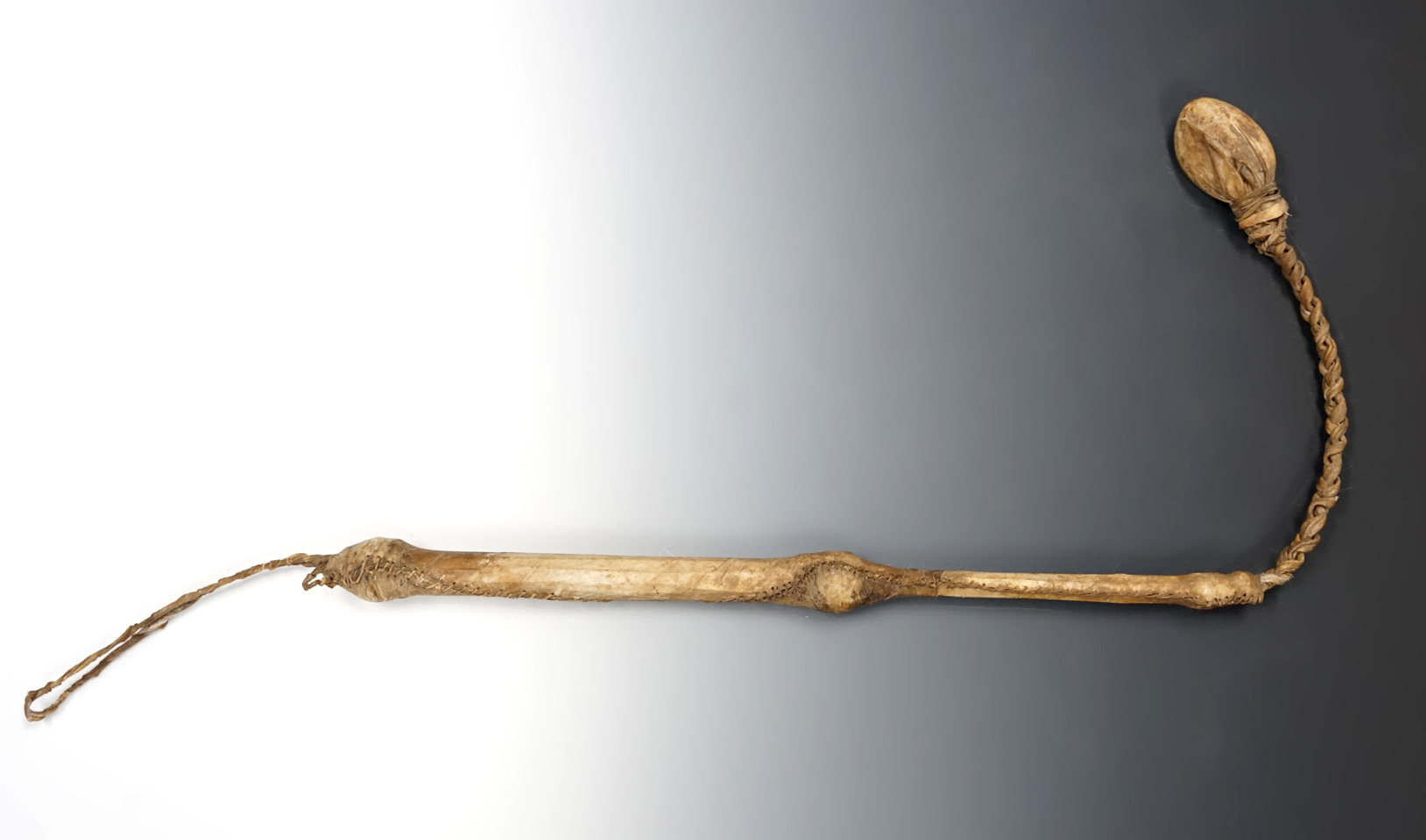 Excellent craftsmanship on this rare 29" long flop style stone head club circa late 1800's.