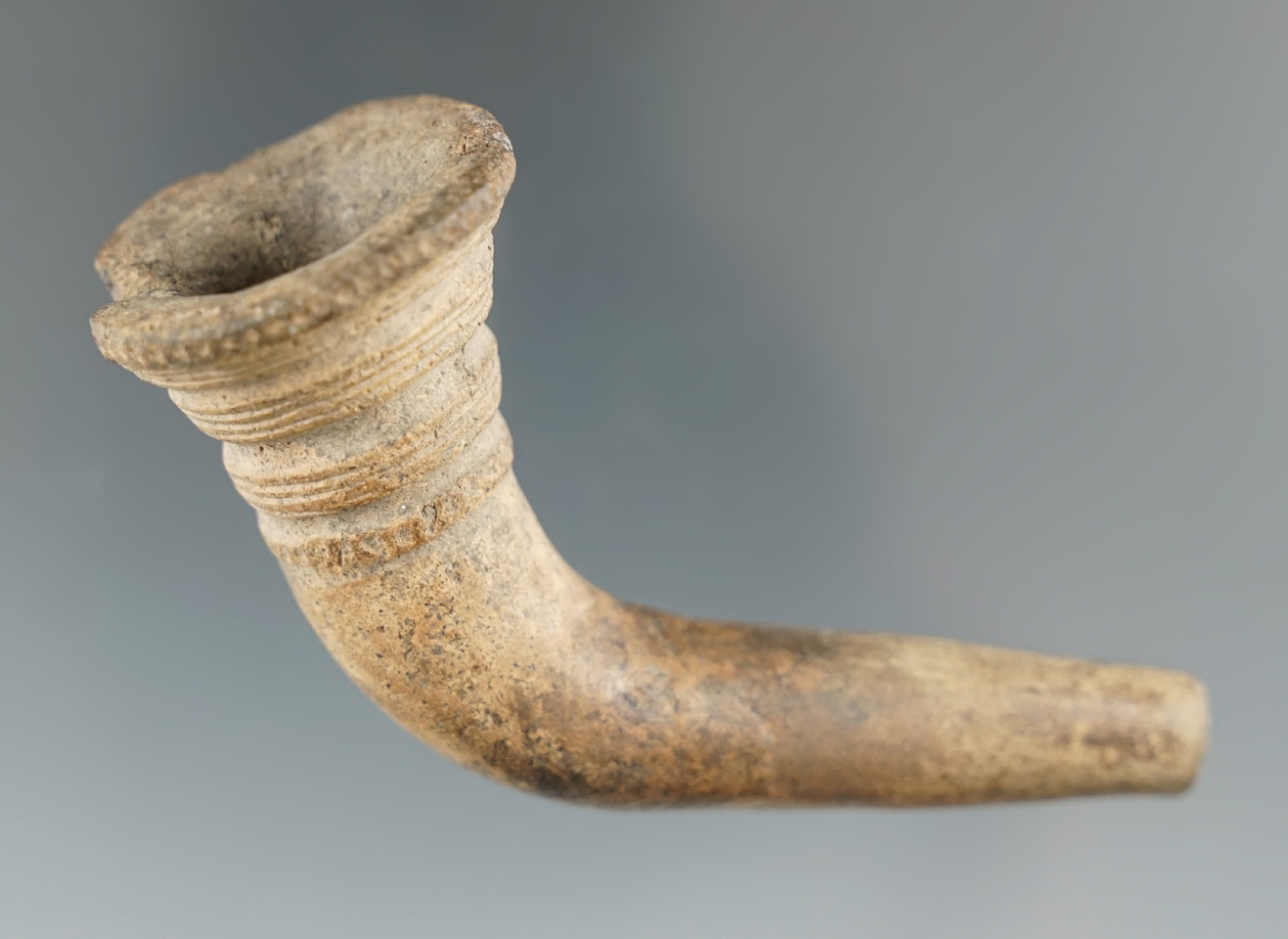 3" Iroquois ring bowl trumpet pipe with a broken and mended stem found in New York.