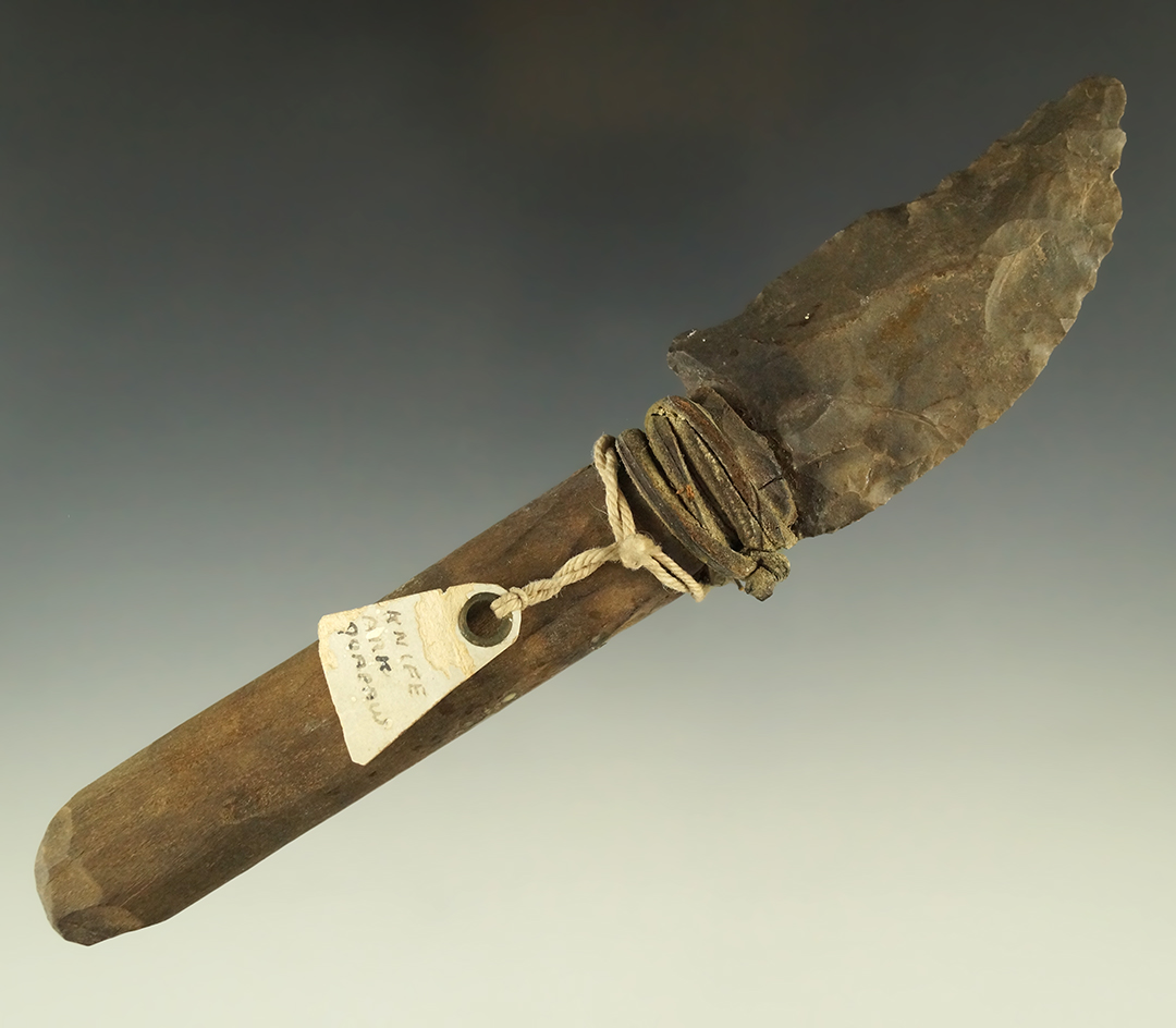 7" long authentic stone knife hafted into a modern handle for display purposes long ago.
