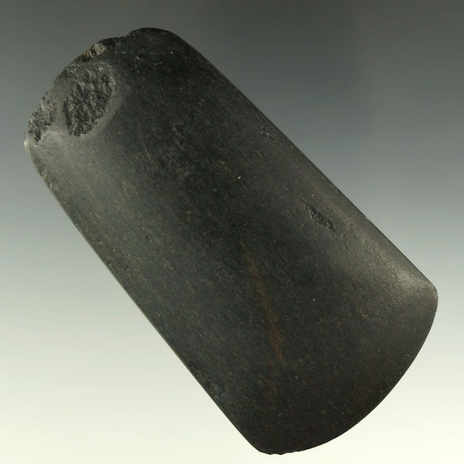 3 5/8" black slate Celt that is highly polished with a nice bit. Michigan, collection of Phil Wagle.