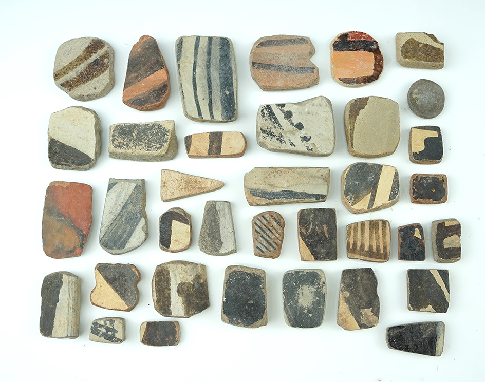 Set of 36 anciently salvaged pottery shards sanded into various shapes. All found in New Mexico.