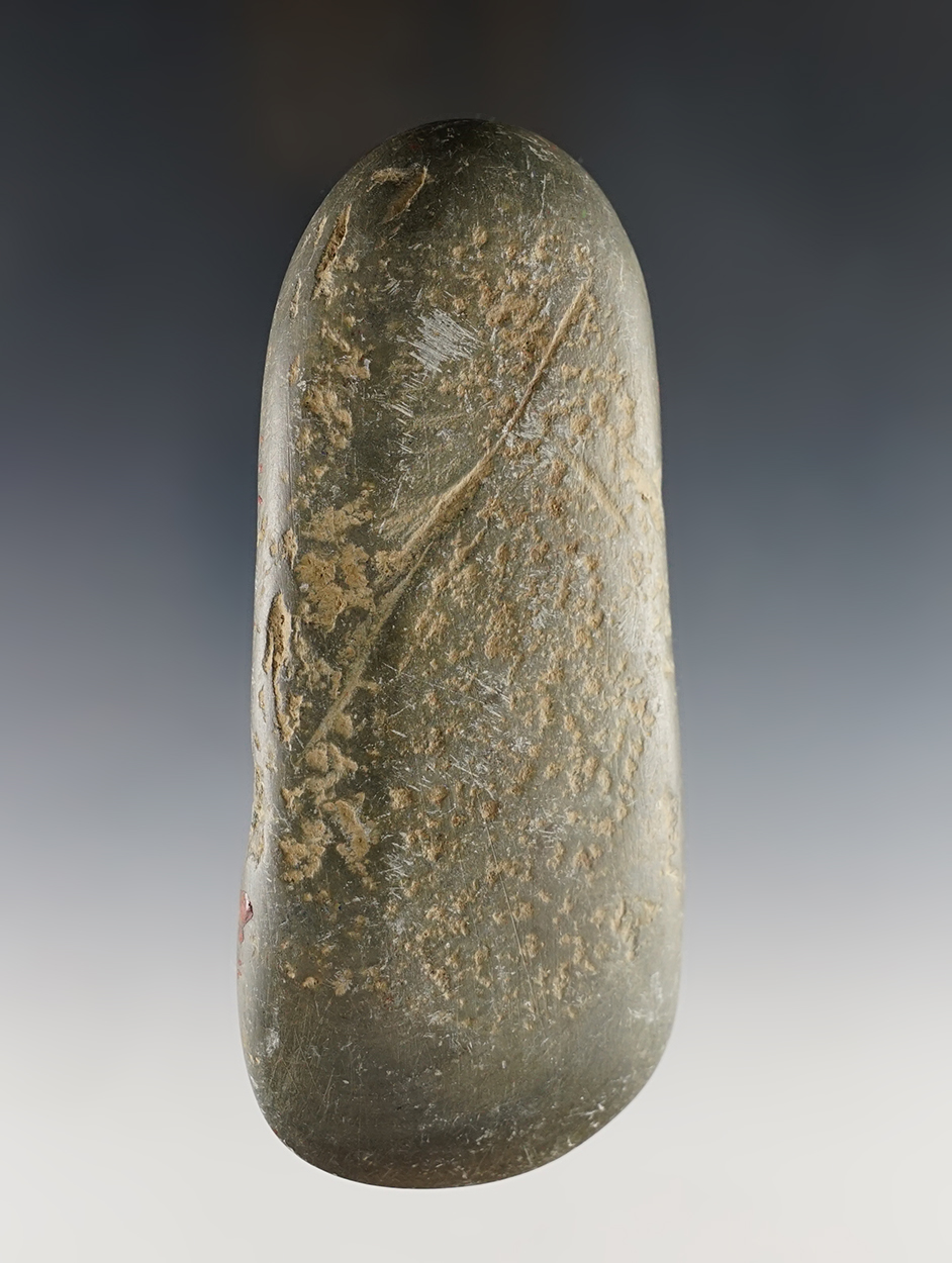 5 1/16" Ohio Celt made from patinated Green Slate. Shows excellent age on surface.