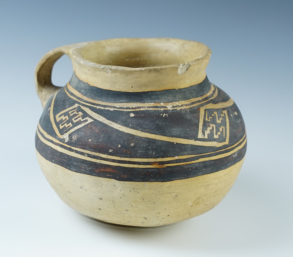 5 1/2" wide Jeddito handled jar - Arizona. Restoration to strap handle, otherwise solid.