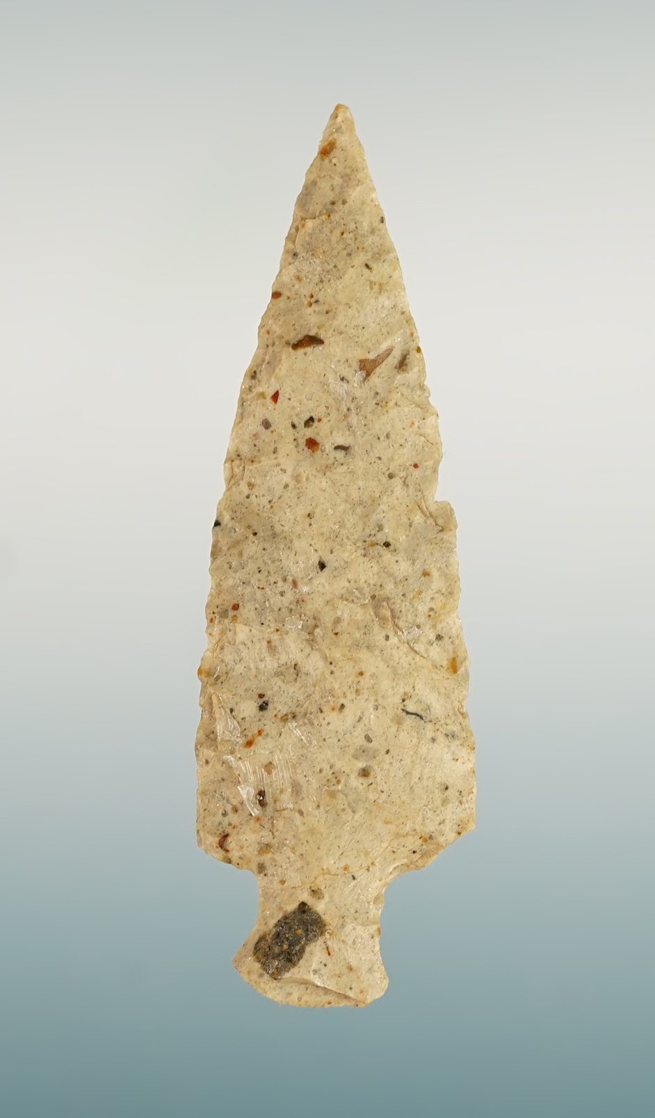 Very thin and nicely flaked 2 9/16" Stemmed Dart point that is well patinated. Colorado.