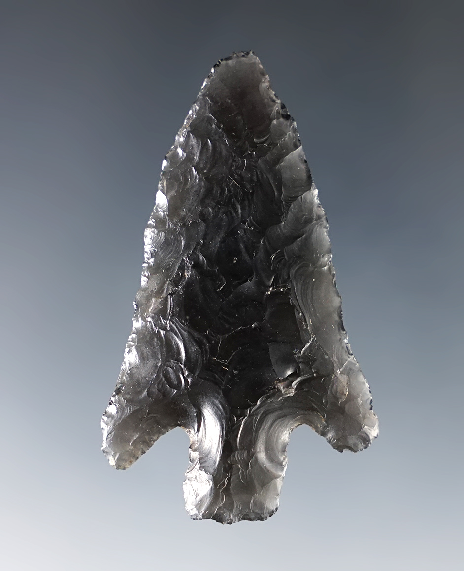 2" Stemmed point made from patinated Obsidian. Found in Northern California.