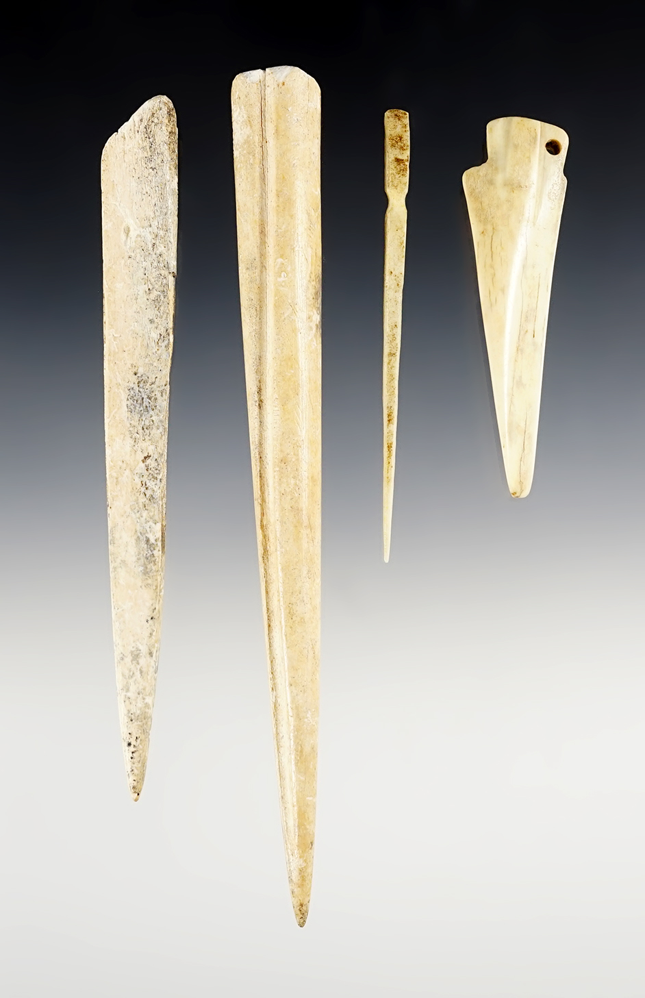 Set of 4 North American Bone artifacts. The largest is 7".