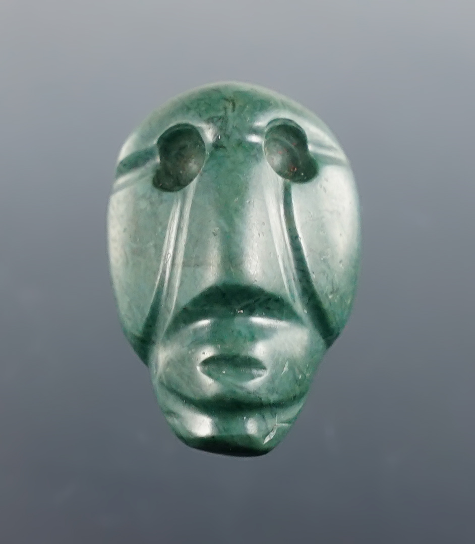 1" Miniature carved head pendant, Guanacaste, Costa Rica, 300 BCE - CE 600. Made from Jade.
