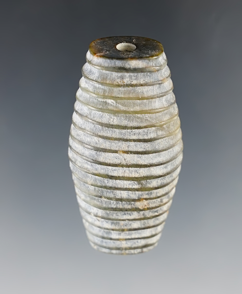 Beautifully decorated in heavily patinated 2" drilled bead  recovered in Southeast Asia. 