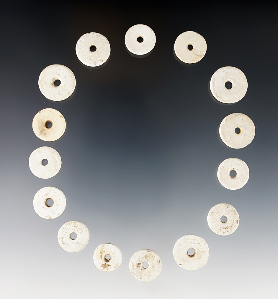 Set of 15 Shell Disc Beads found at the White Springs Site, Geneva, New York. The largest is 3/4".