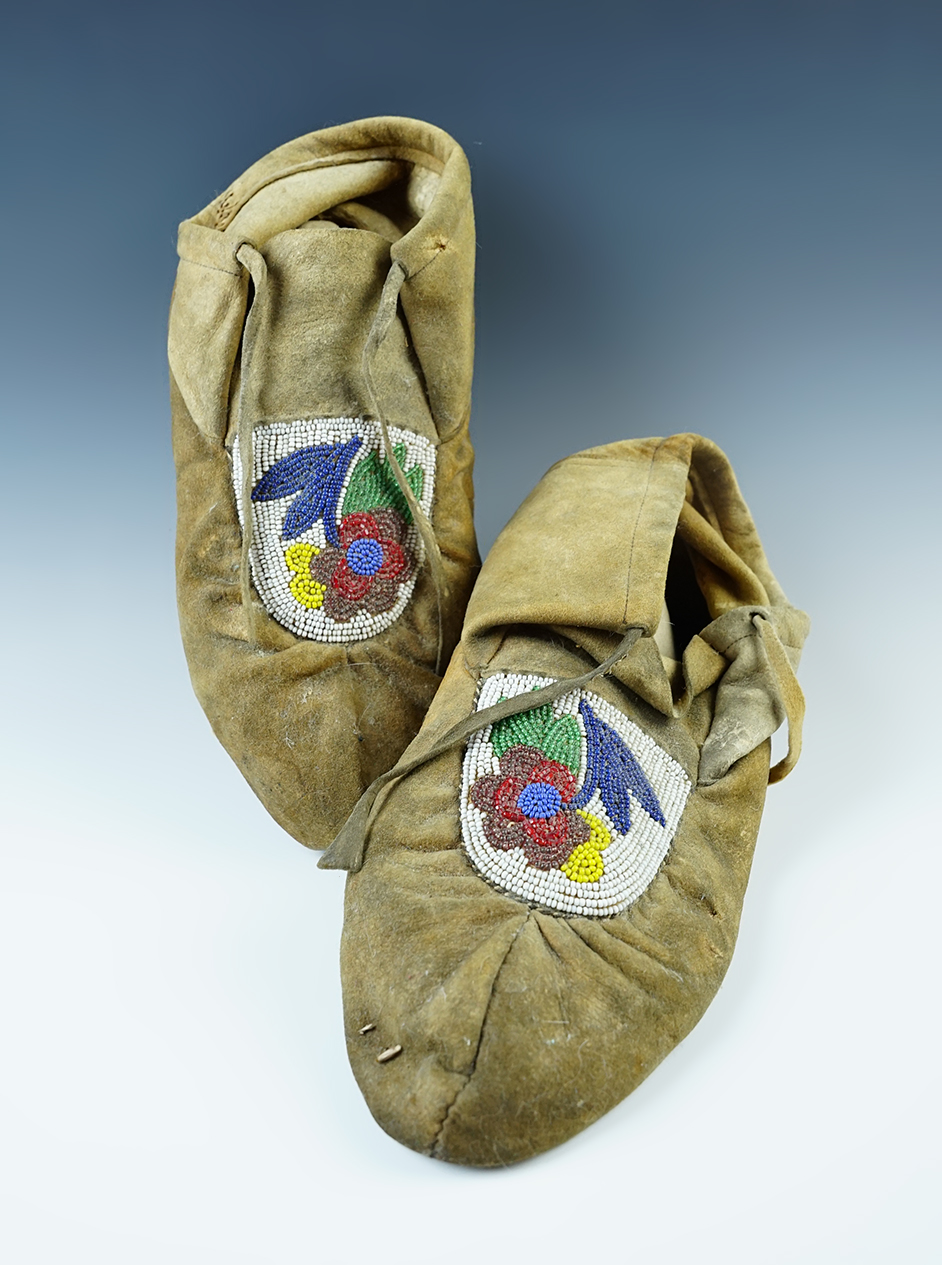 Pair of Great Lakes area floral beaded leather Moccasins that are 9 1/2" long. 