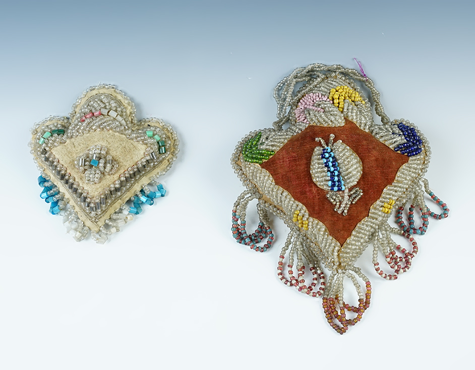Pair of Iroquois trade beadwork pin cushions circa 1890s-1920s. Largest is 6 1/2".