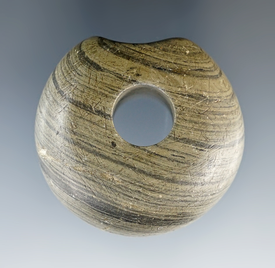 1 3/4" Archaic Flattened Ball Bannerstone with a fluted bottom found in Butler Co., Ohio.