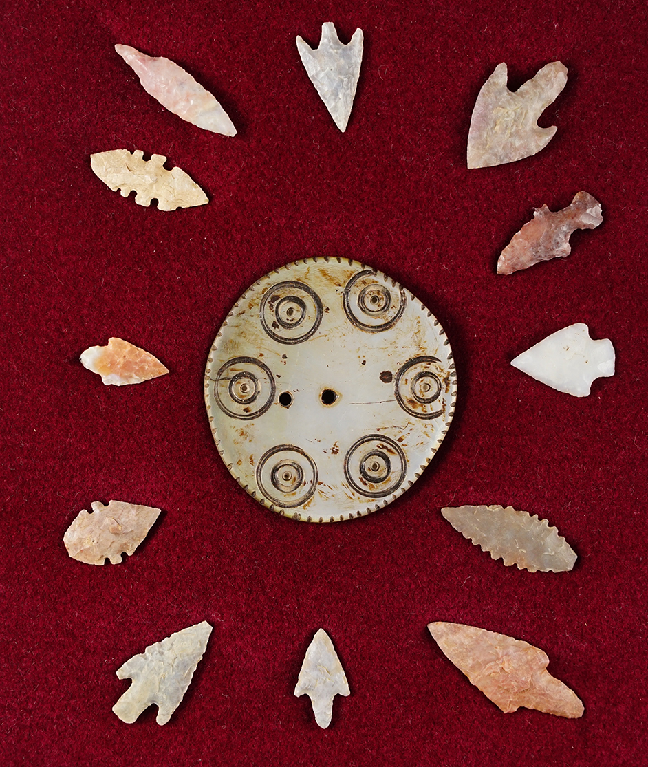 Set of 12 mostly African Neolithic arrowheads and a 2 1/4" decorated Shell Gorget from Africa.  