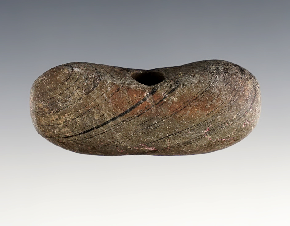 2 3/4" bannerstone made from slate. Found in Morrow County Ohio.