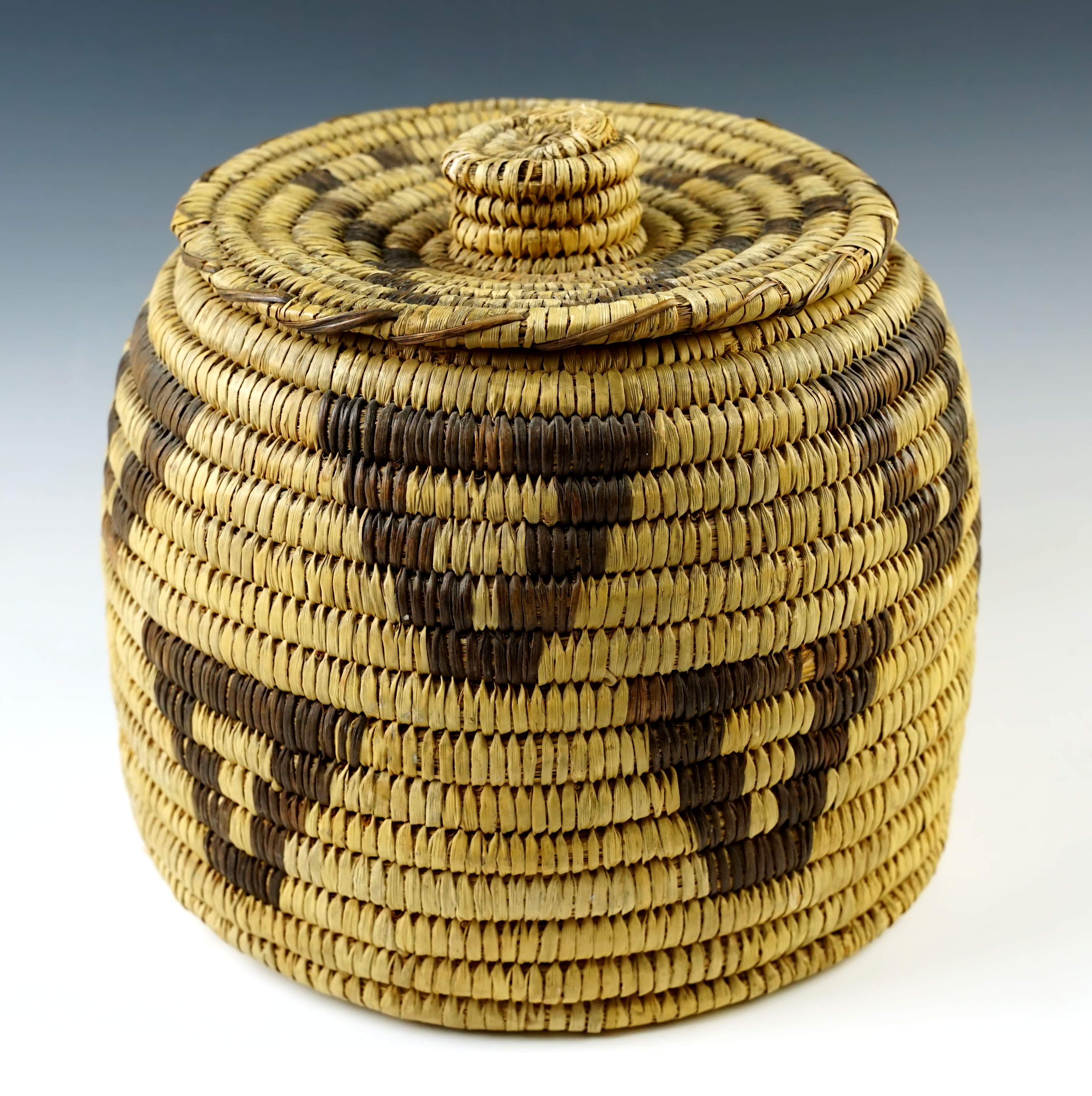 7" tall by 8" wide Vingate Papago Lidded Basket in excellent condition. 