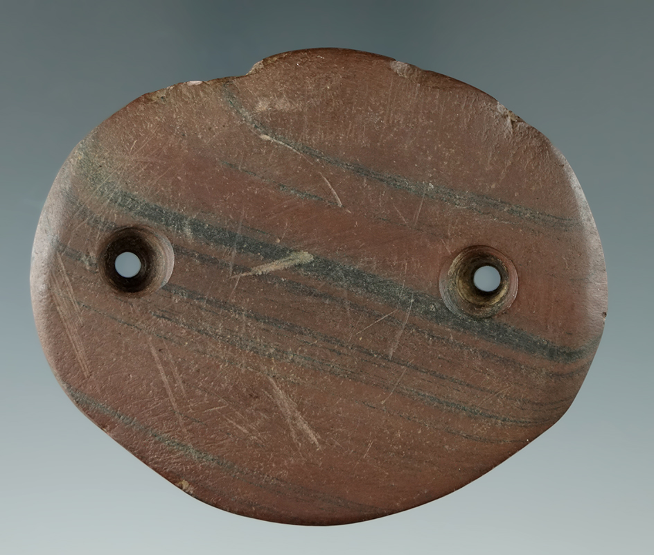 Uniquely styled 2 13/16" red and black banded slate Oval Gorget with nice engravings. New York.